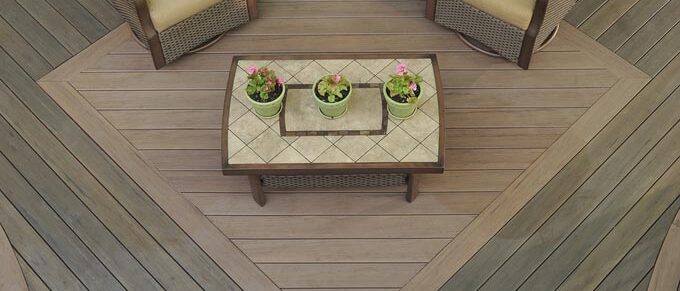 Aerial view of deck with two chairs, coffee table, and hammock.