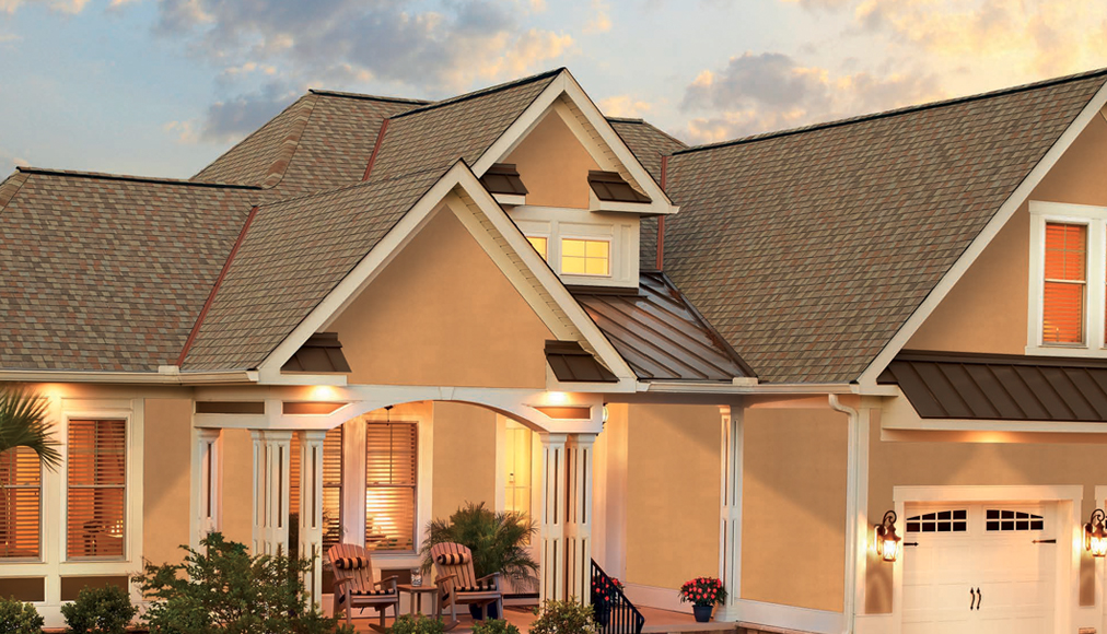 Outside view of a house at sunset.