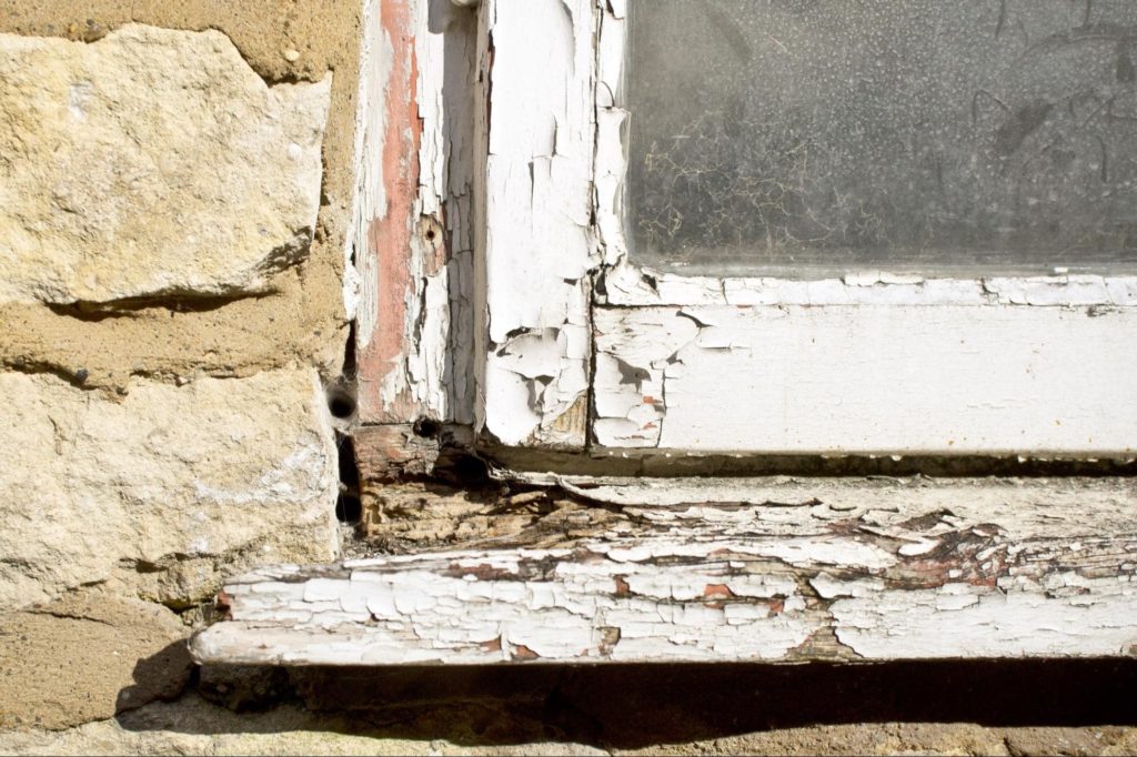 A picture of a cracked window pane, showing the need to find the correct types of replacement windows.