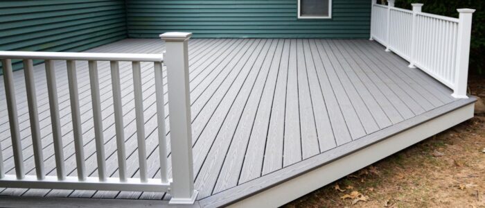 A platform deck with teal vinyl siding.