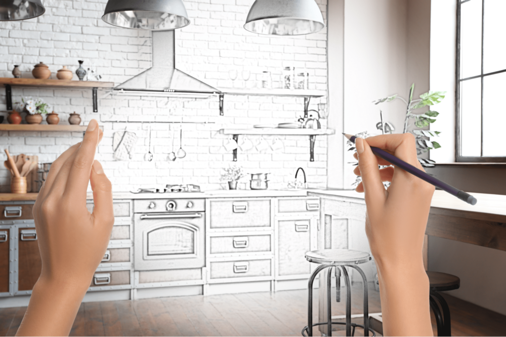 Two hands sketching an artistic representation of their dream kitchen.