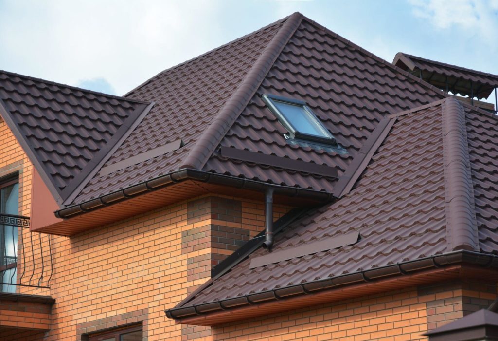 A picture of a roof with metal tiles.