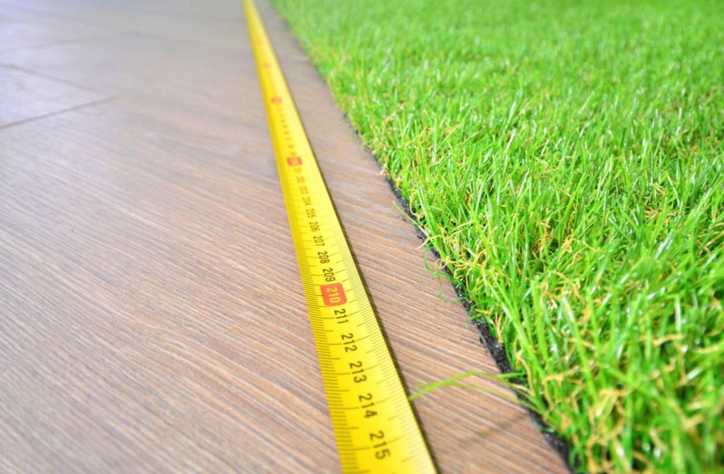 A picture of a tape measurer on a wood surface.