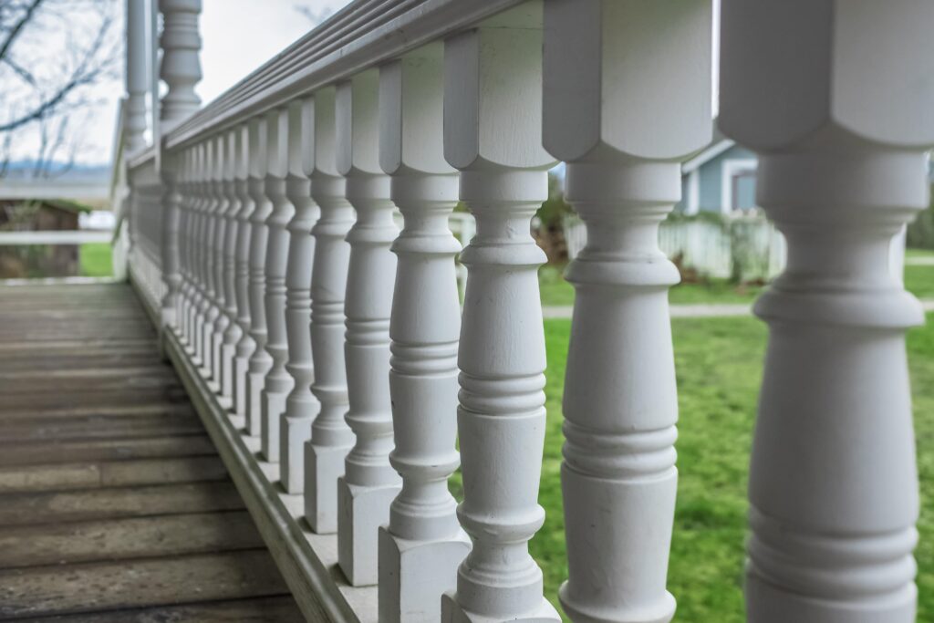A close-up shot of a wooden deck railing.