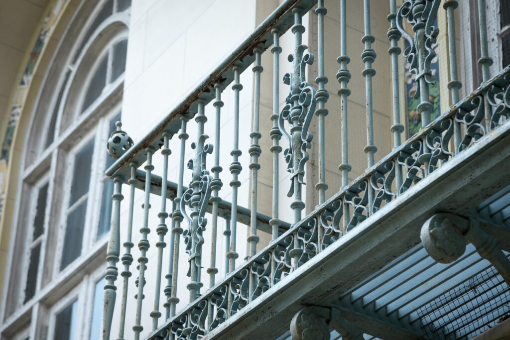 A close-up shot of wrought-iron railings.