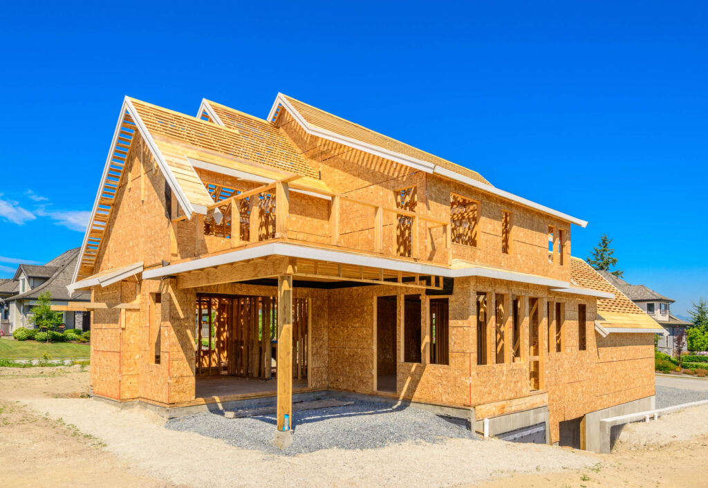 An image of a home being constructed on a sunny day.