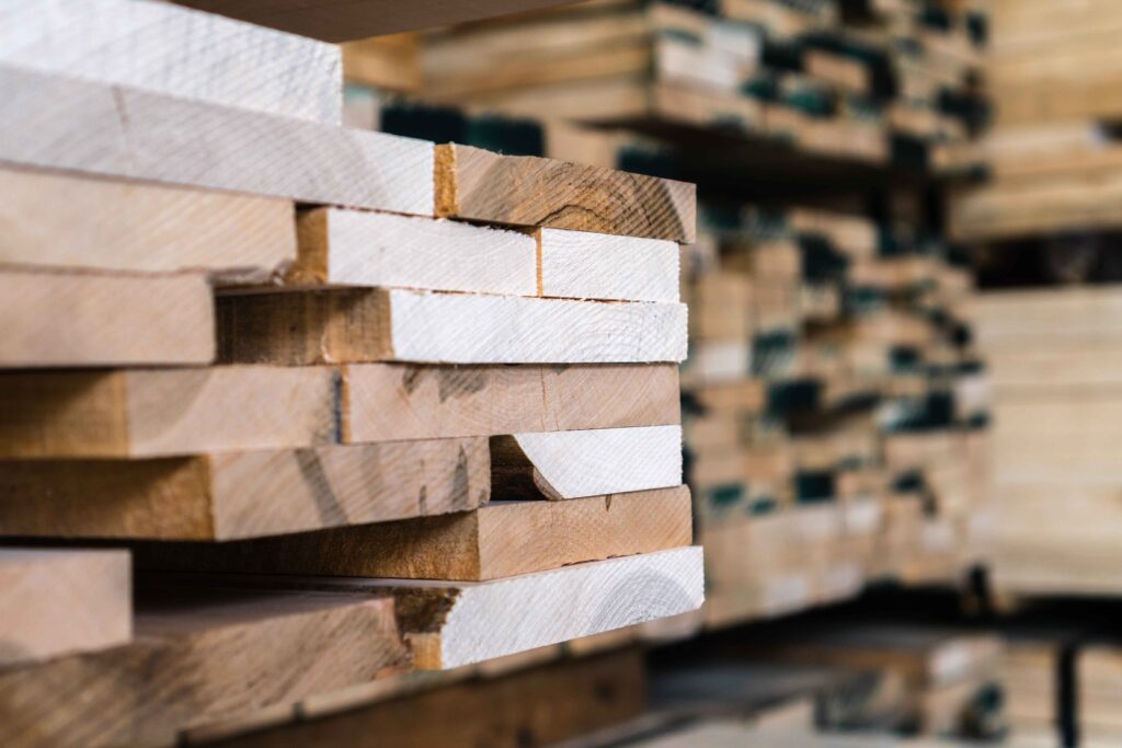 A closeup image of stacked wood on a shelf.