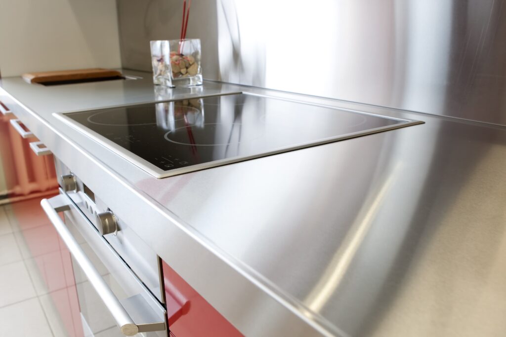 A kitchen with a stainless steel countertop.