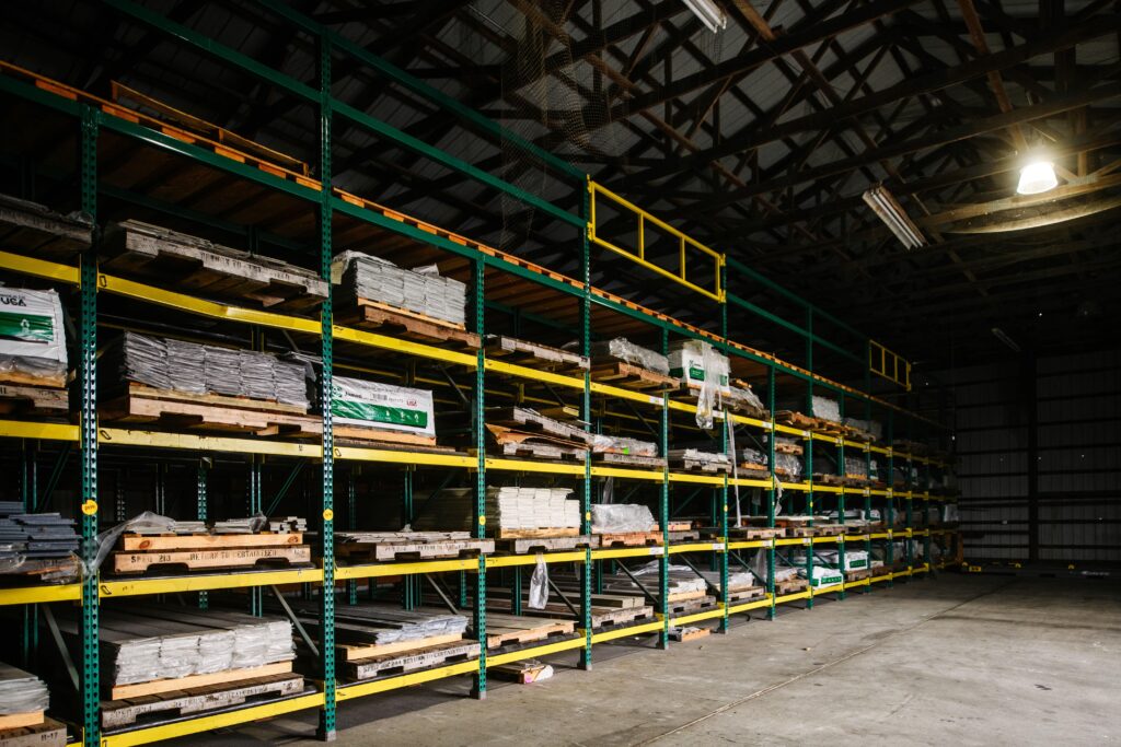 The interior of a building materials warehouse with shlevs full of materials.